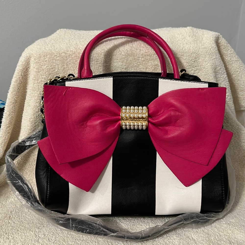 Betsy Johnson bow satchel purse shoulder strap never used.  Purse Like new.